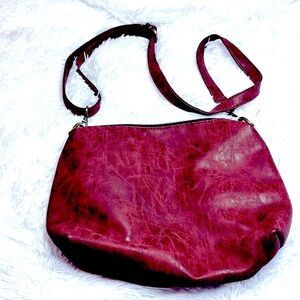 Nwot Susan Joy crossbody adjustable bag.  Vegan leather rustic red